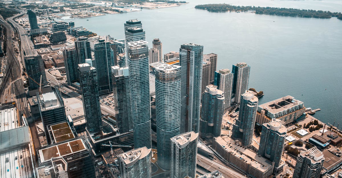 How to get from Toronto Downtown to Pearson Airport - Aerial Photo Of Buildings Near Body Of Water