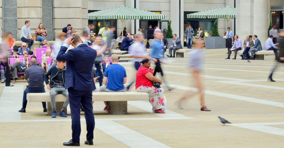 How to get off a London bus when sitting on the top deck? - Man Wearing Blue Suit on Beige Ground Near Building How to get off a London bus when sitting on the top deck? - Man Wearing Blue Suit on Beige Ground Near Building