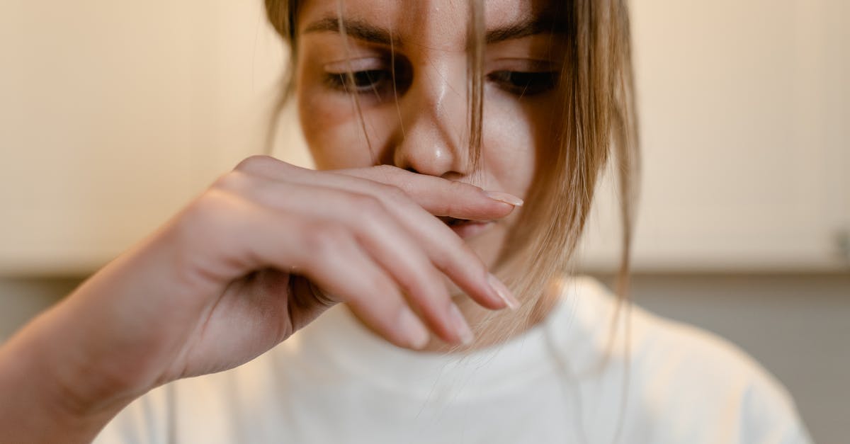 How to get over the fear of flight? [duplicate] - Woman in White Shirt with Hand Over Lips
