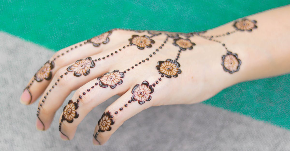 How to get temporary Permesso di Soggiorno? [closed] - Floral Design Henna Skin Dye on a Woman's Hand