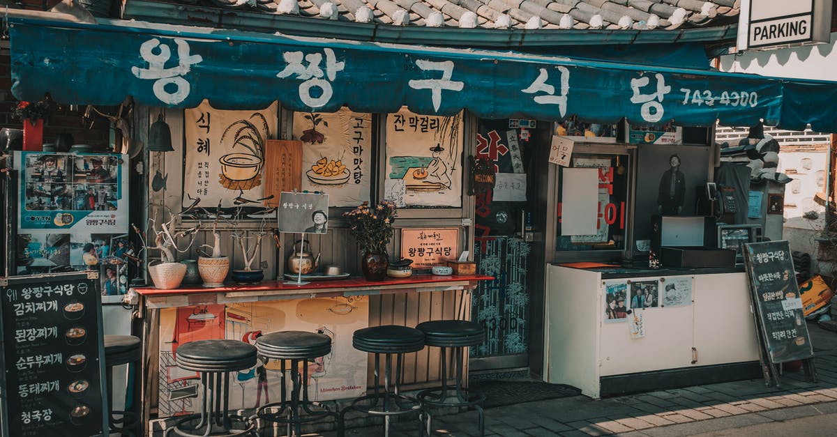 How to get the front seats in an airline? [closed] - Photograph of an Old Store's Front