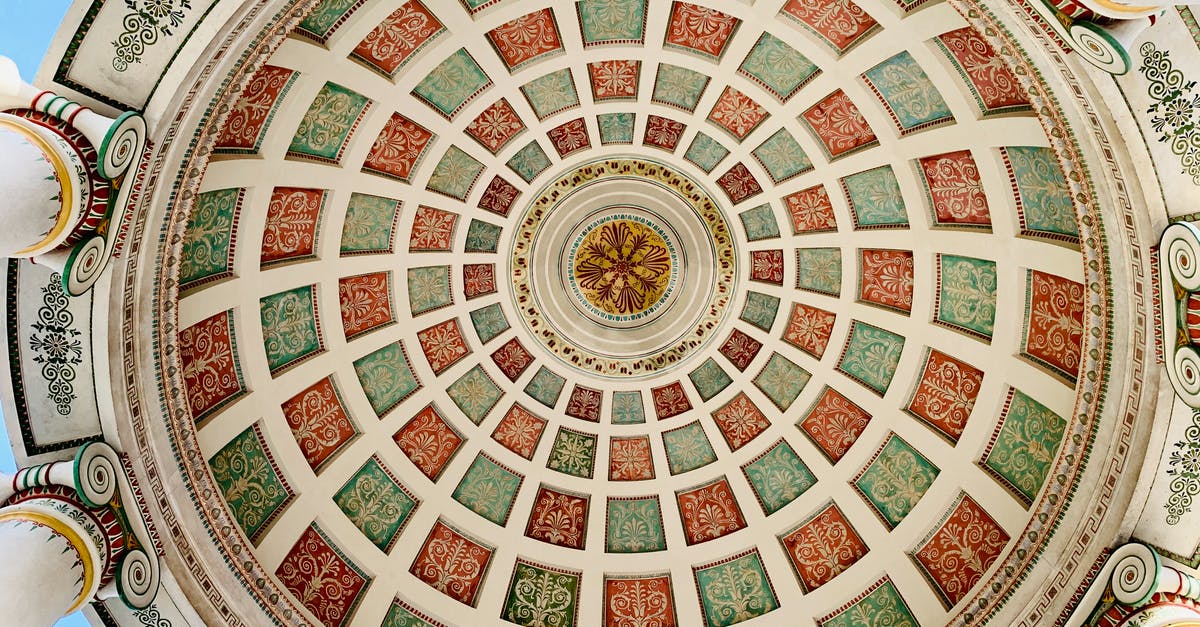 How to get to Munich from Helsinki? - Ornamental ceiling of aged colonnade on sunny day