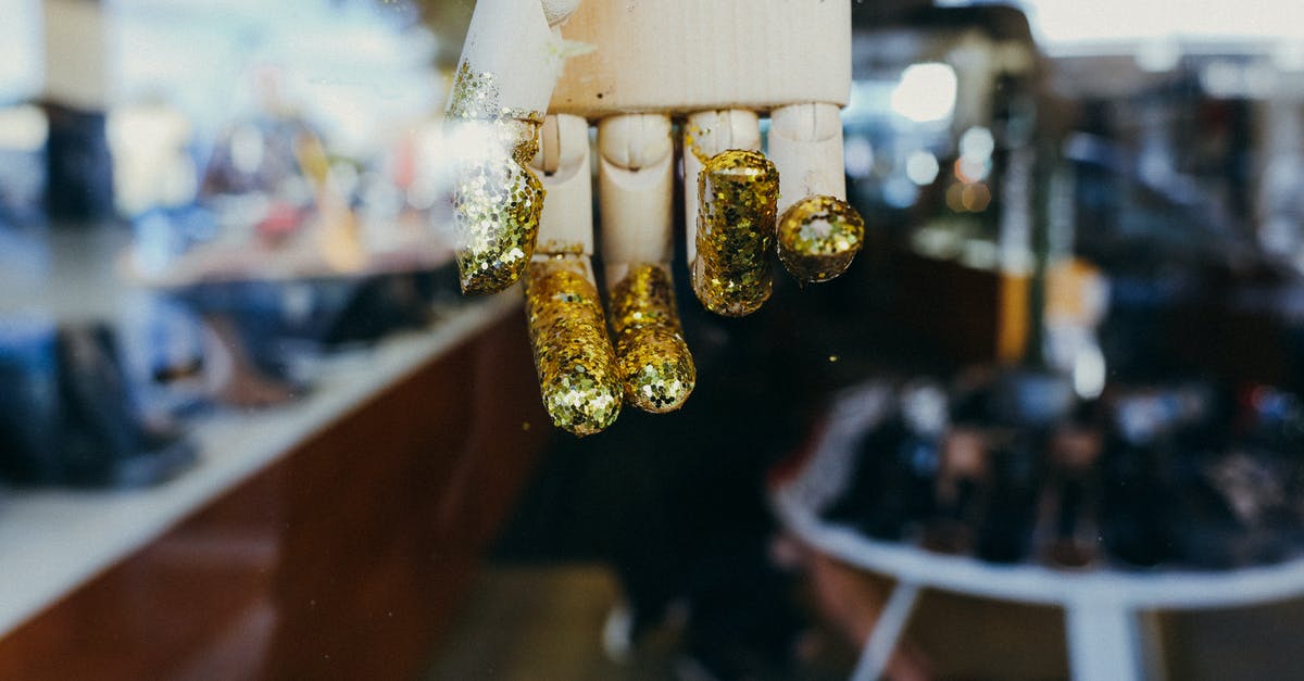 How to get to the Golden Lane (Zlatá ulička) in Prague? - Hand of Wooden Mannequin with Golden Glitter and Cafe behind a Glass