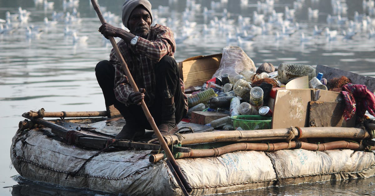 How to go boating on Pichavaram lake? - Man Sitting on Boat