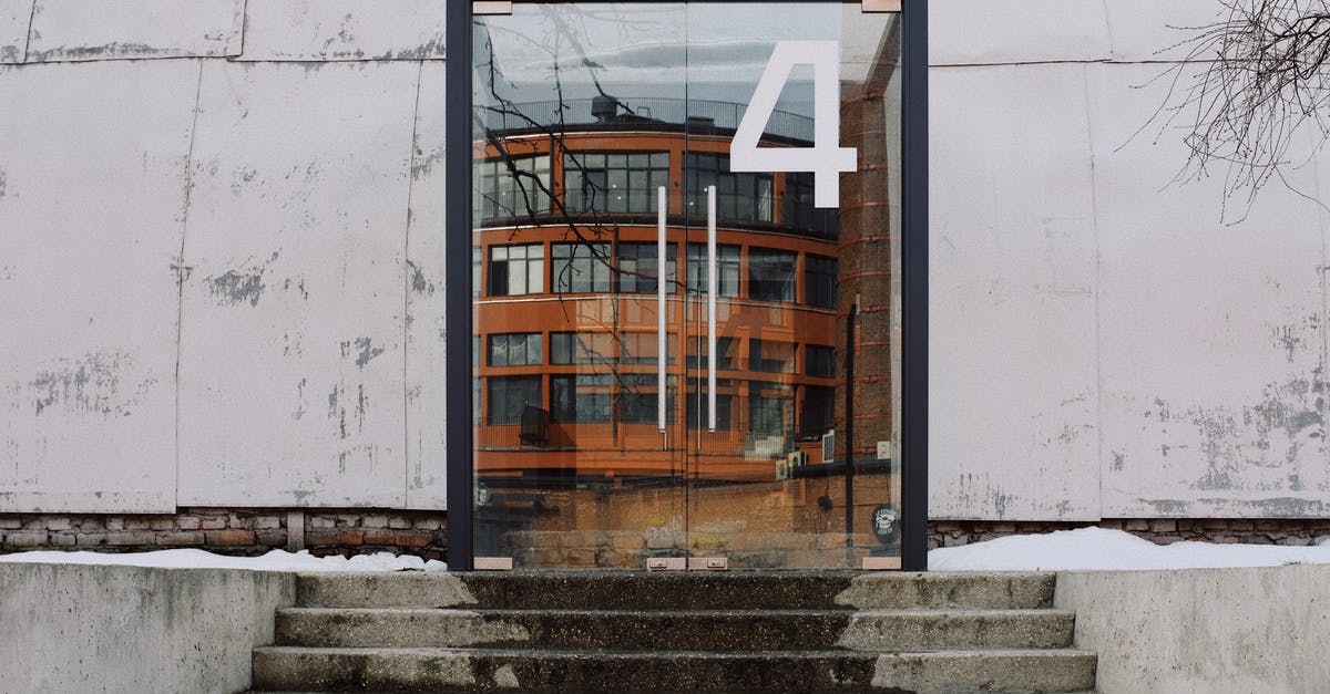 How to go from all four Moscow's (DME-SVO-VKO-ZIA) international airports to the city center? [closed] - From below of modern building facade with number four on glass entrance door and stairs