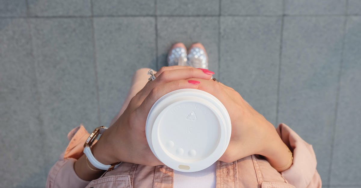 How to go from Gilimanuk to Denpasar? - Person Holding White Disposable Cup