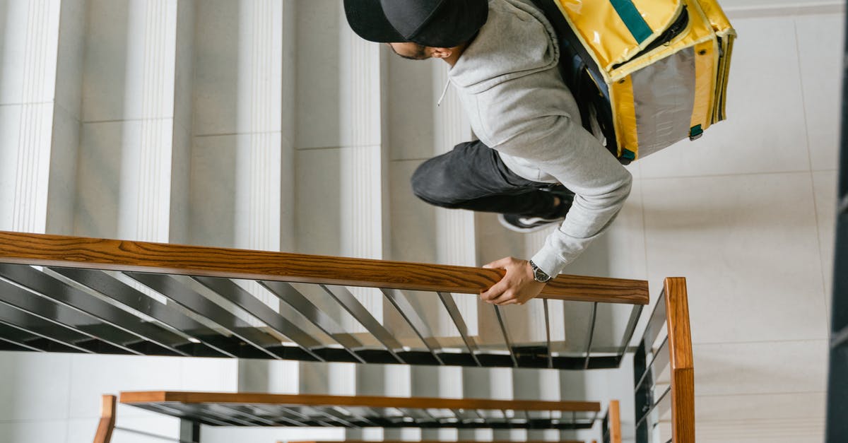 How to go from Warsaw Modlin airport to Warsaw? - Deliveryman Going Up the Stairs