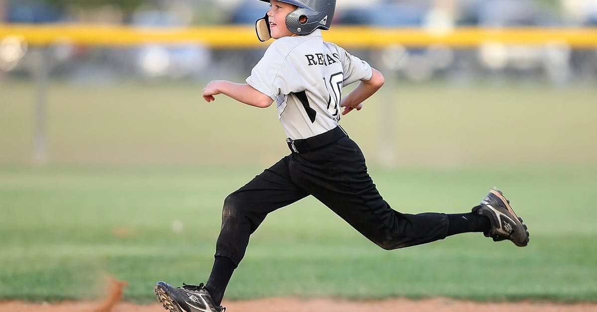 How to go to a baseball game in Cuba? - Baseball Player in Gray and Black Uniform Running