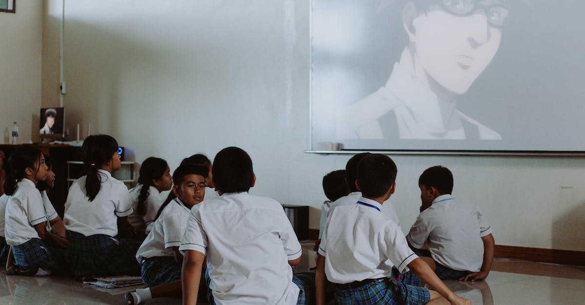 How to insure checked luggage? - Children in School Uniforms Watching Movie in Classroom
