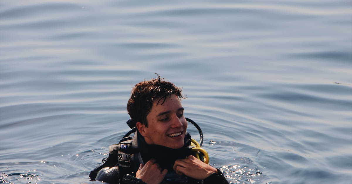 How to insure yourself as an independent traveling scuba diver? - Photo of Man Smiling