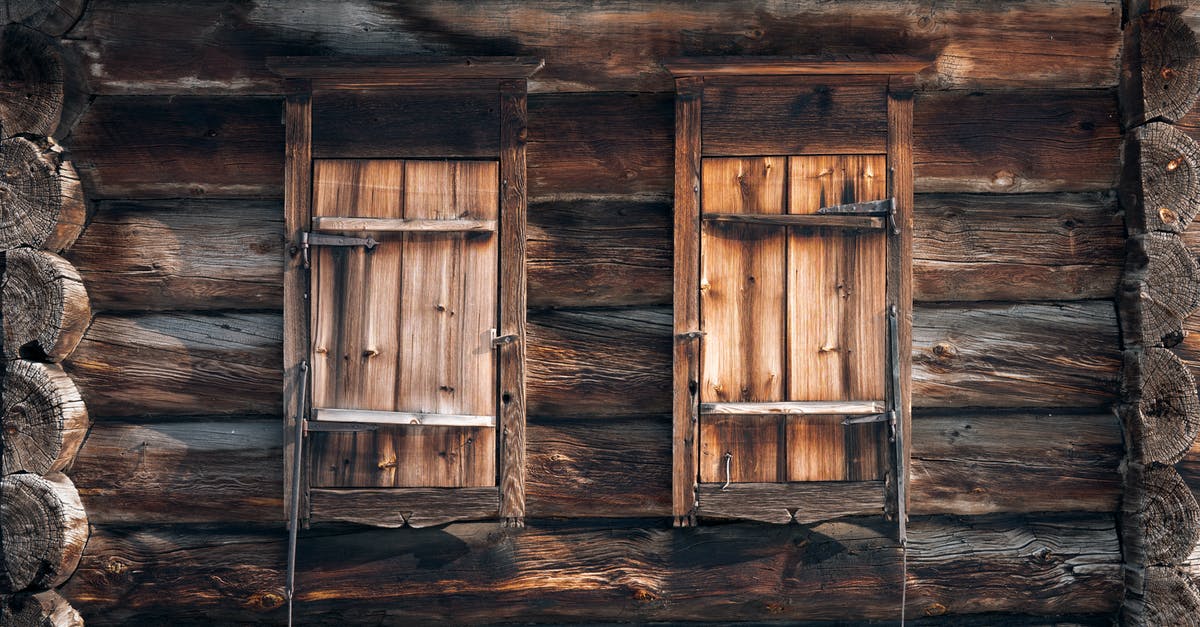 How to log the places you visited as detailed as possible? - Detail of exterior of shabby rustic house made of wooden logs with closed windows on sunny day