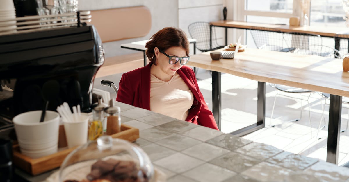 How to make dining alone less awkward? - Woman in Red Blazer Sitting on Chair in Front of Table