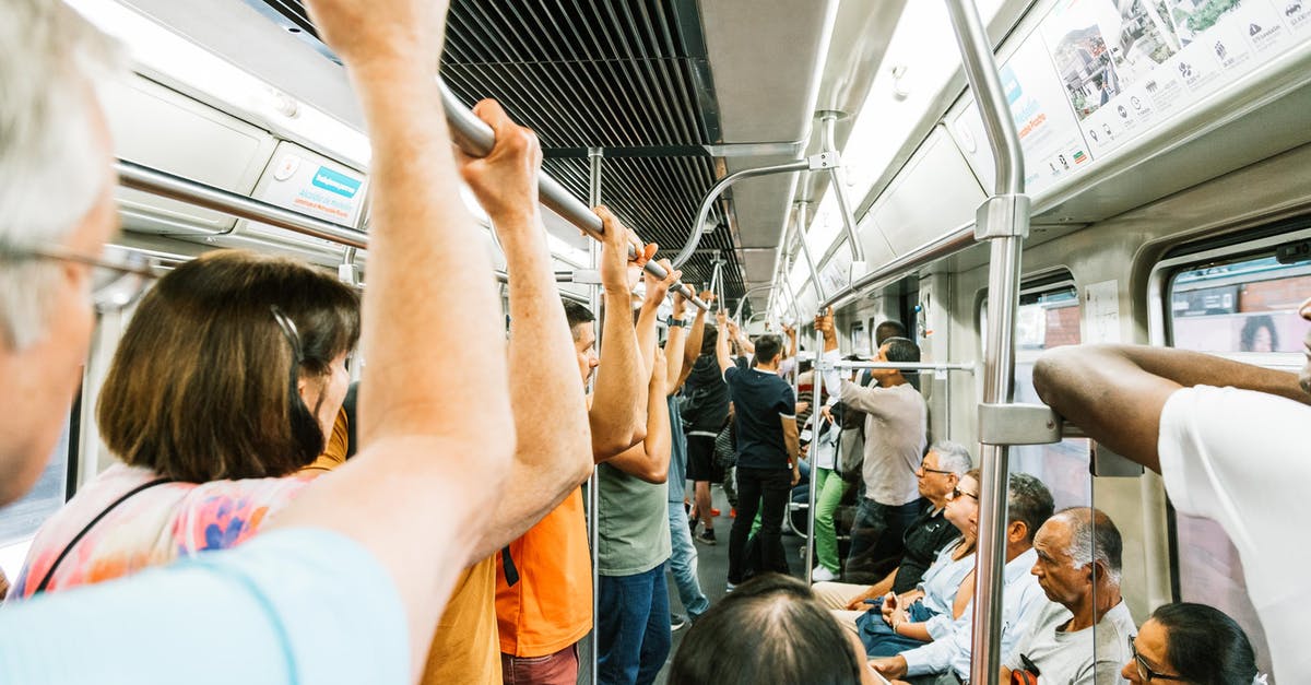 How to manage a longer transit location in a cheaper way - Metro train full of people during busy day