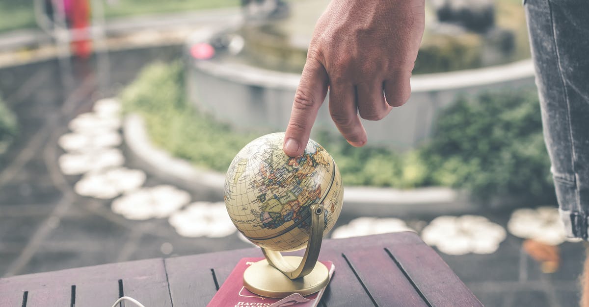 how to plan a round the world trip? [closed] - Person Holding Terrestrial Globe Scale Model Taken