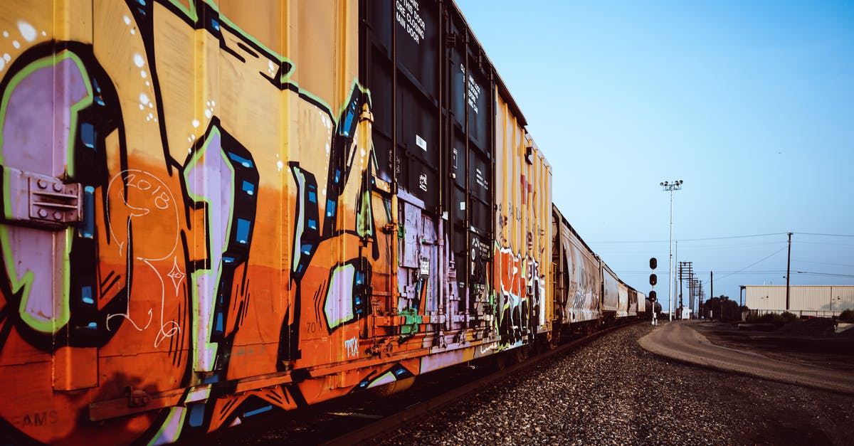 How to prepare for very long train journeys? - Containers with colorful graffiti drawings