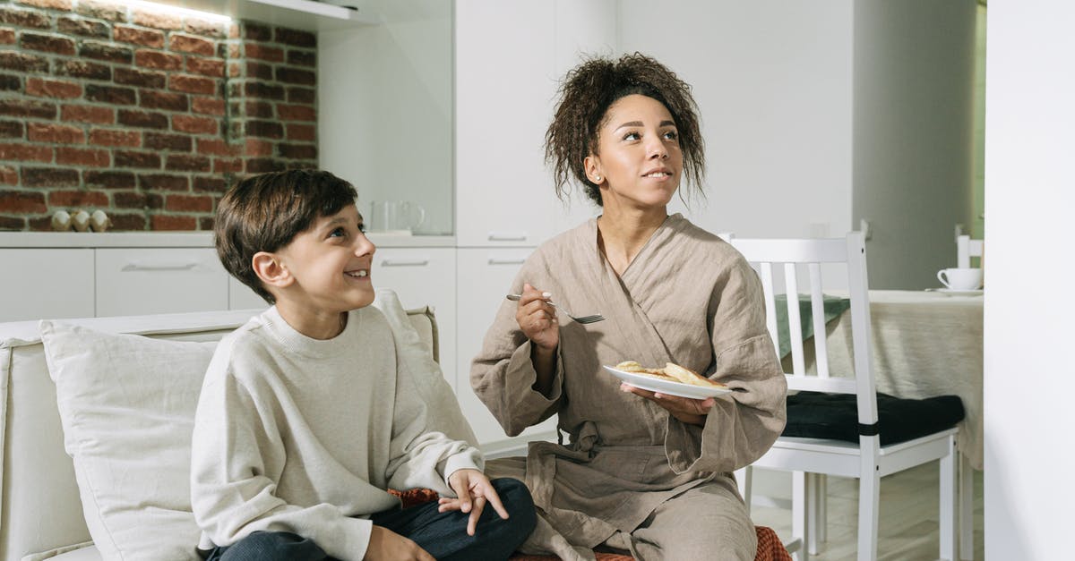 How to provide evidence of family allowance in visa application? - Man in Gray Sweater Sitting Beside Woman in Gray Sweater