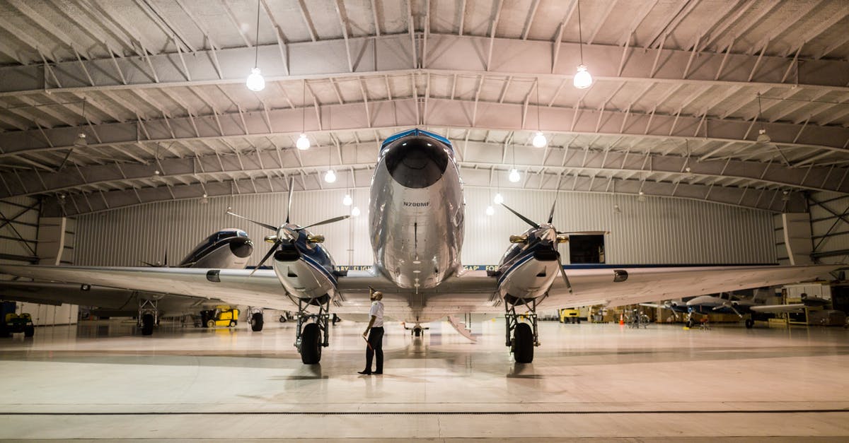 How to reach BSL airport from Freiburg by mid-morning? - Gray Plane Inside Hangar