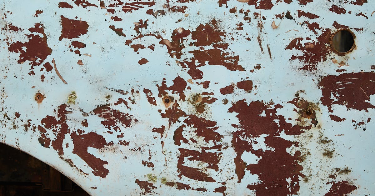 How to reach Old Faithful (Yellowstone) from Jackson Hole in December? - From above of shabby abandoned metal construction with round hole and rusty spots among white paint