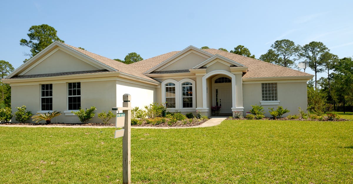 How to redeem an American Airlines voucher? - White and Brown Concrete Bungalow Under Clear Blue Sky