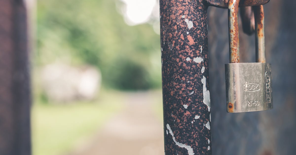 How to secure a passport in a BNB [closed] - Rusted Grey Padlock in Selective-focus Photography