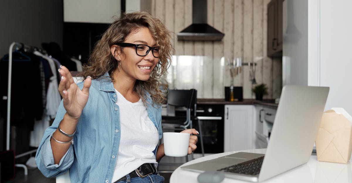 How to stay connected with friends, family while abroad? - Woman Using Laptop Doing A Video Call