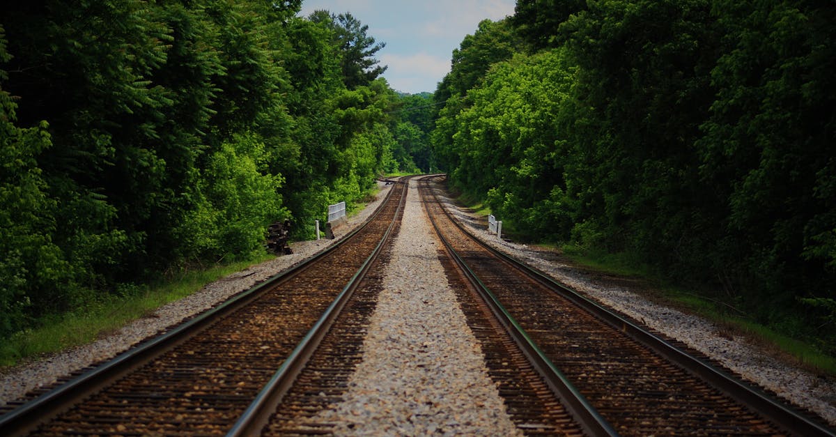 How to tell distance travelled by rail? - Brown Train Railway Between Green Trees at Daytime