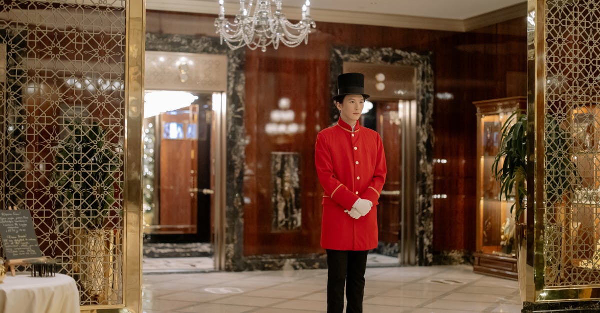 How to tip a concierge or a hotel porter? - Man in Red Uniform