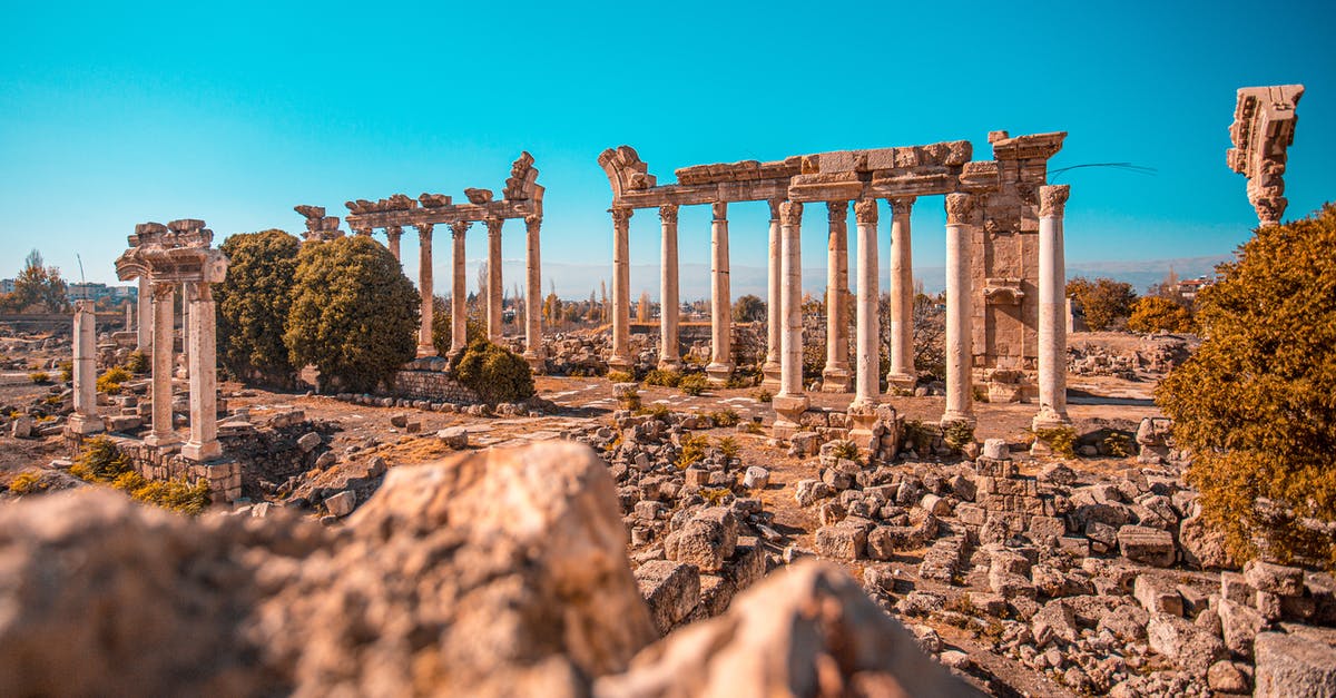 How to travel to Lebanon without flying? - White Concrete Pillars Under Blue Sky