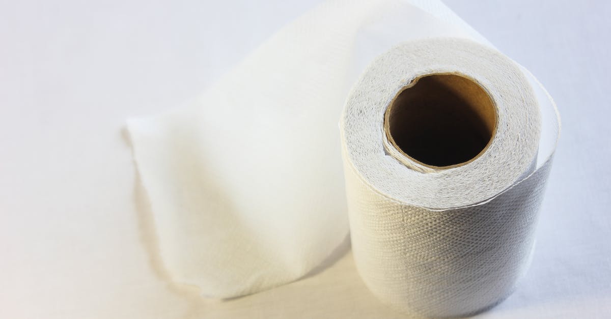 How to use toilet paper - White Tissue Roll on White Textile