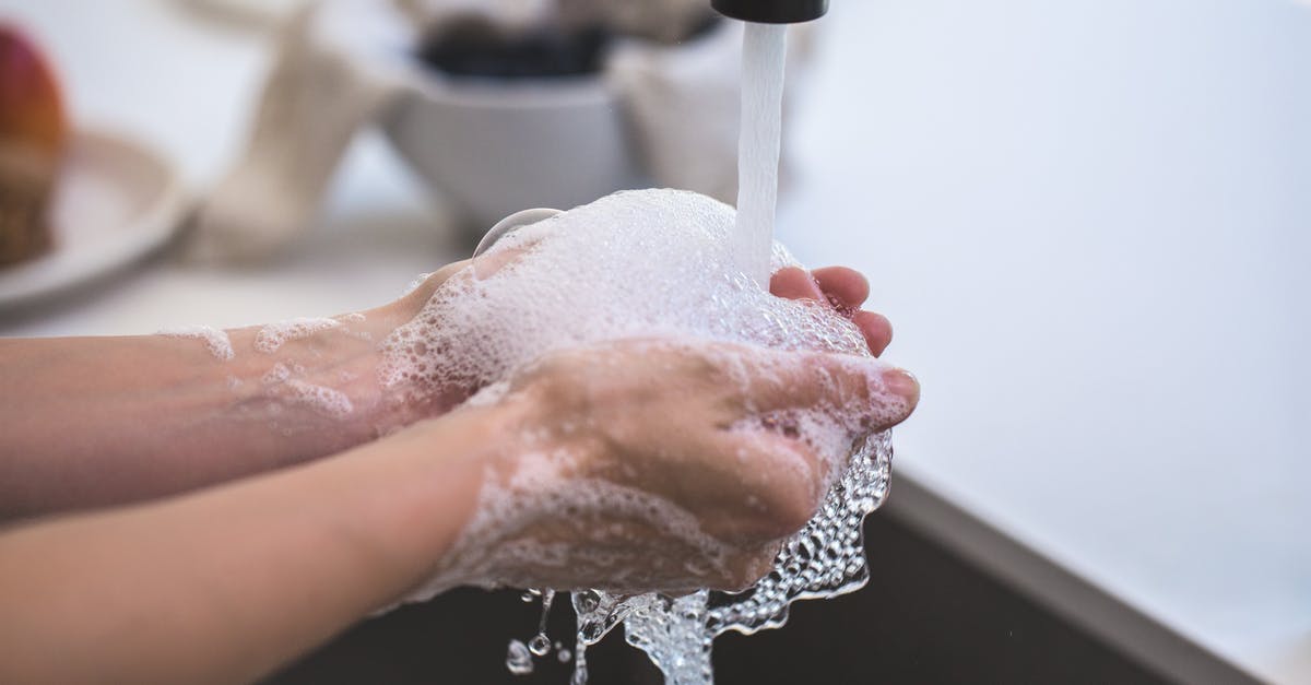 How to wash hands if tap water is too hot? - Person Washing His Hand