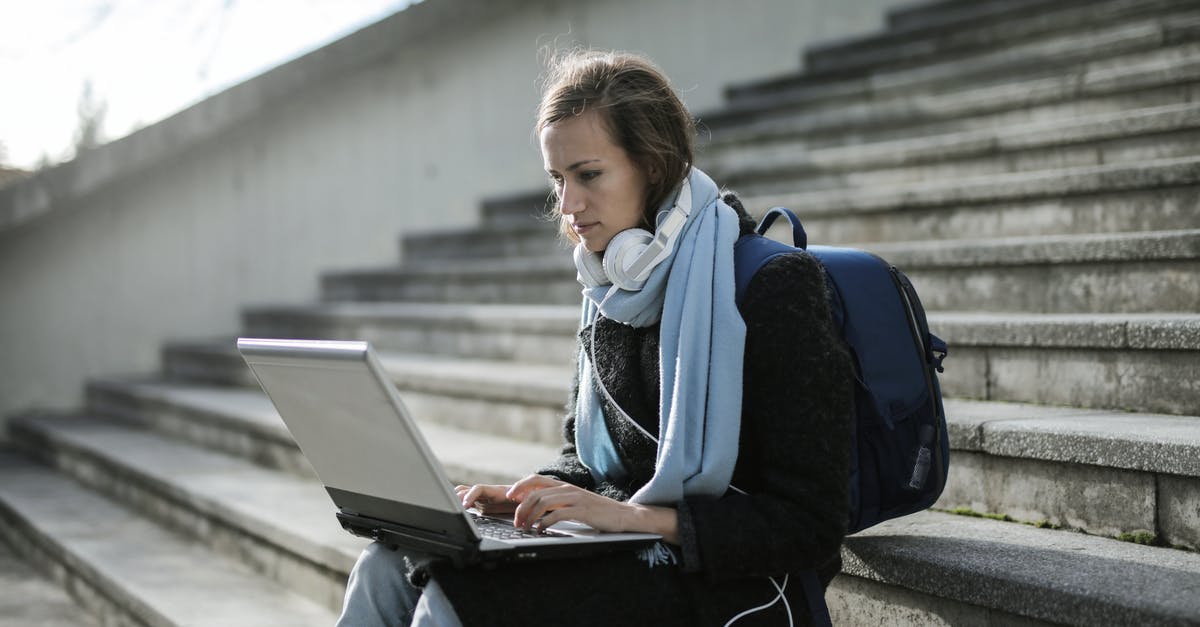 How useful or necessary is a pacsafe for your backpack? - Woman Sitting On Concrete Stairs Using Laptop