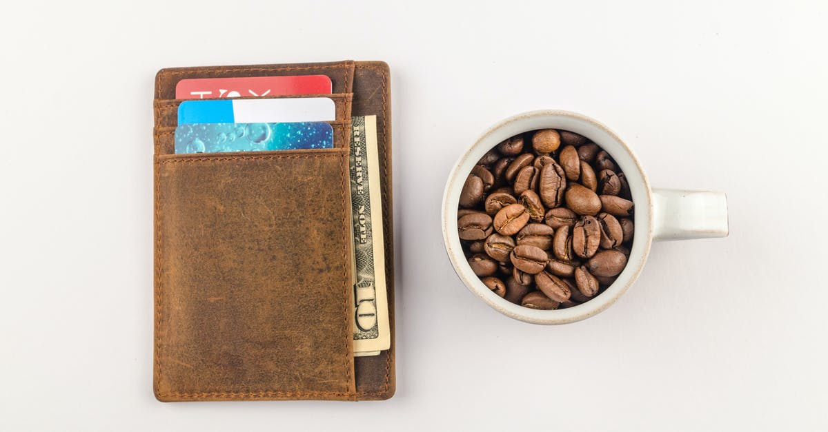 How widely Master/Visa credit/debit cards are accepted in Slovenia (Julian Alps)? - White Mug with Coffee Beans Beside Brown Wallet