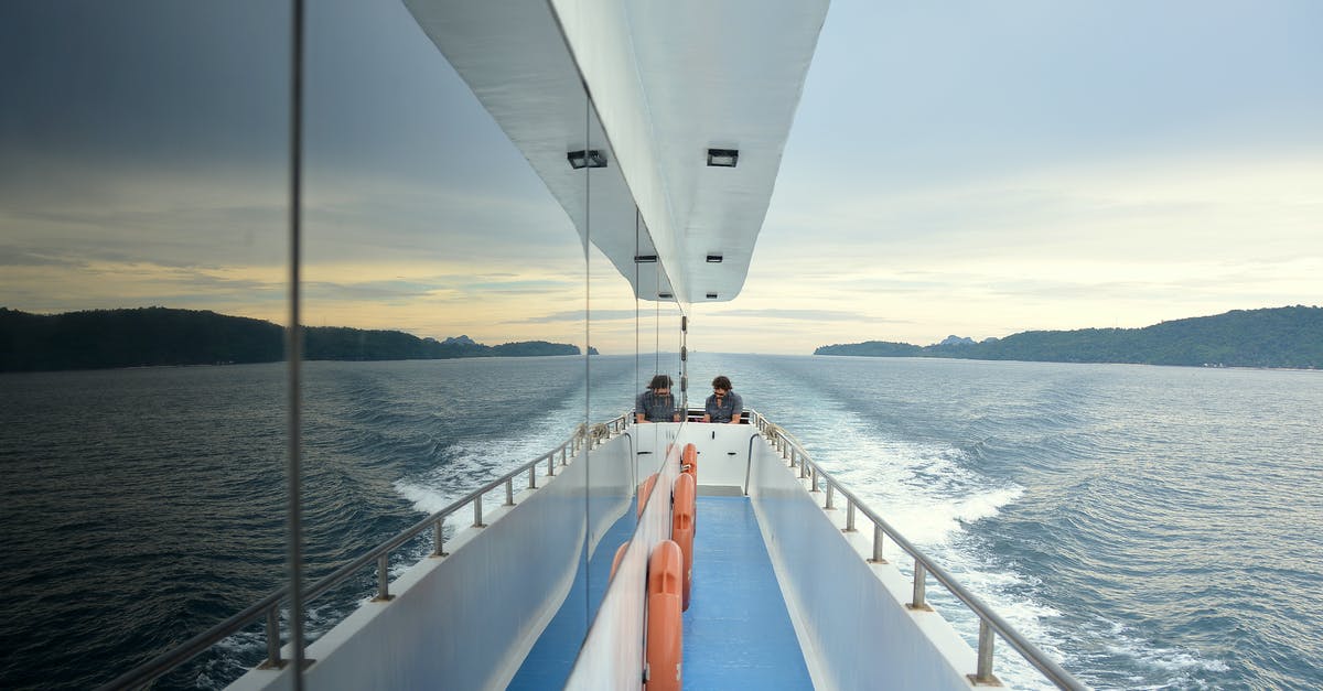 How widespread is sailing between Japanese islands in private yachts? - Person Sitting on Boat