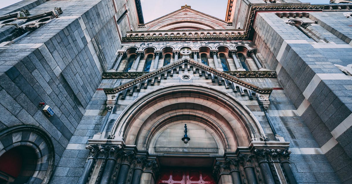 I'd like to book a flight transiting Dublin in order to use hidden-city ticketing. How can I find all flights transiting through Dublin from NYC? - Low Angle Photo of Blue Concrete Building