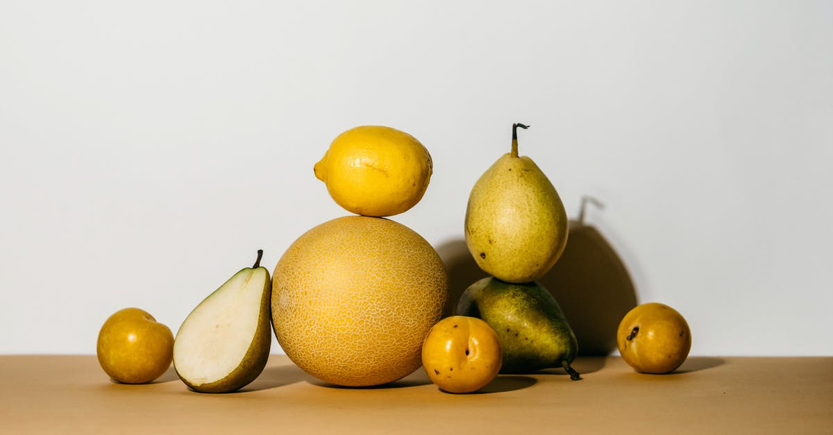 I-94: a half an hour overstay - A Group of Yellow Fruits and Green Pear on Brown Surface