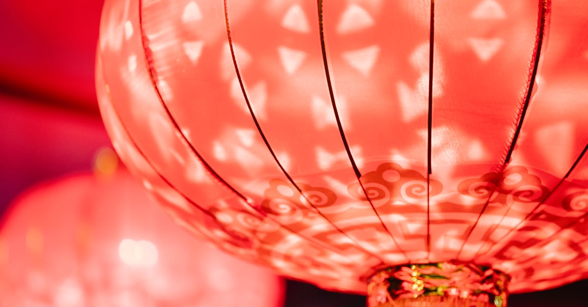 I have booked a flight from the USA to China and am a dual national. How do I avoid China getting to know this? - Glowing red Chinese lantern for traditional event
