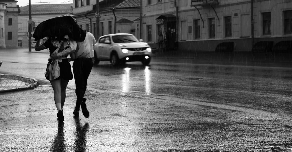 ID check crossing the Italian-Swiss border by car - Two Person Crossing the Street