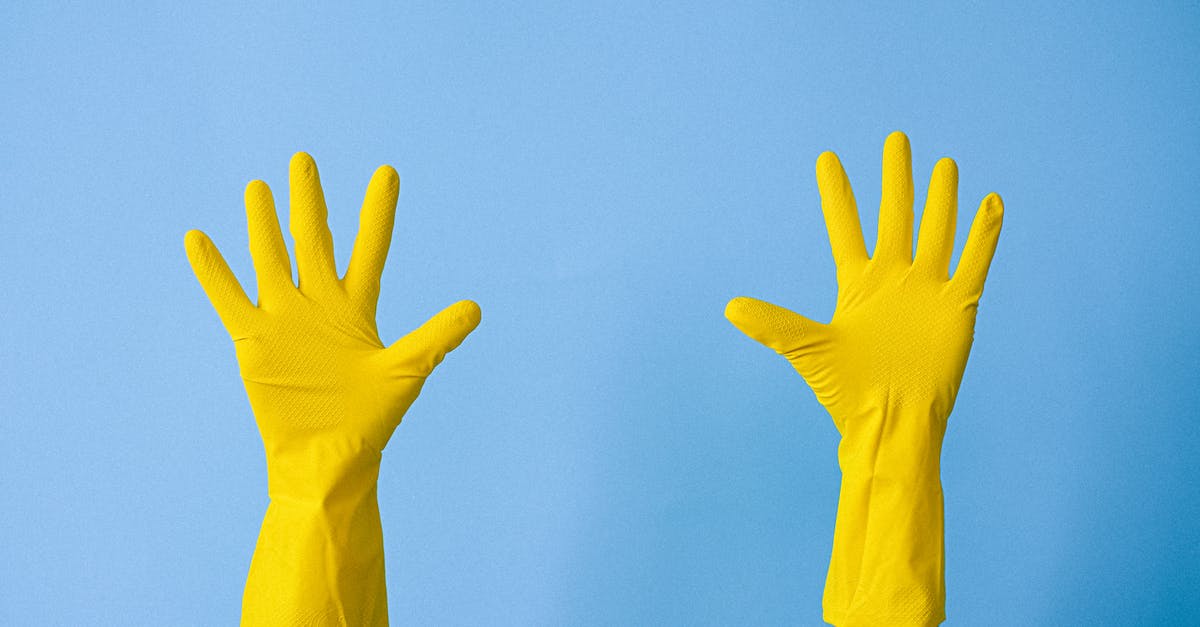 If I have to put up with bed bugs can I prevent bites or stop the itch? - Crop unrecognizable person in rubber gloves raising arms