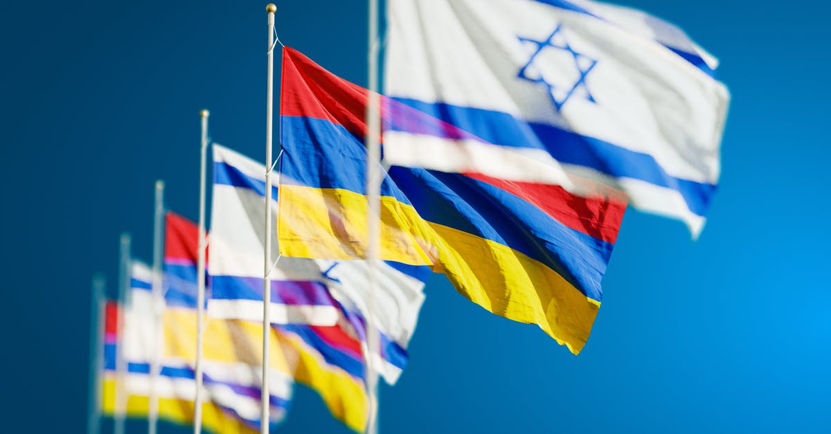 If I visit countries neighbouring Israel, may some countries deny my entry? - White and Yellow Striped Flag