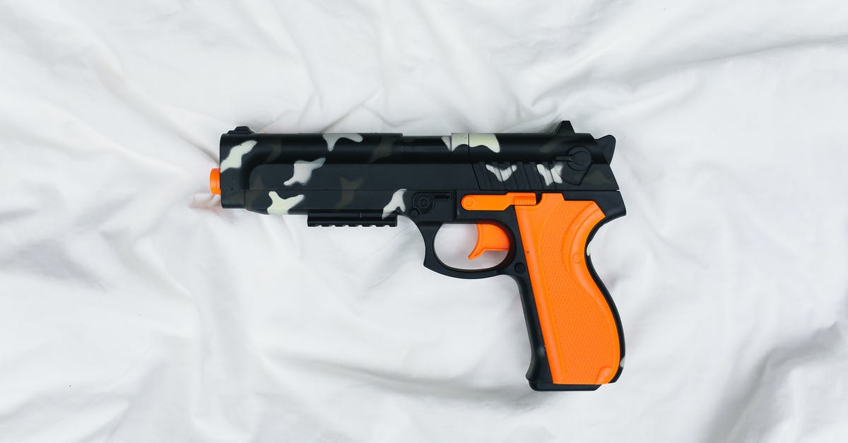 Immi account password recovery without answering security questions - Black and Orange Semi Automatic Pistol on White Textile