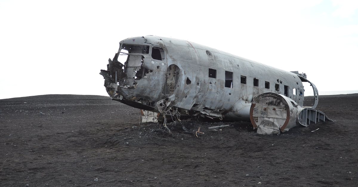 In Aviation terms, what is a Ground Stop? - Gray Airplane on Seashore