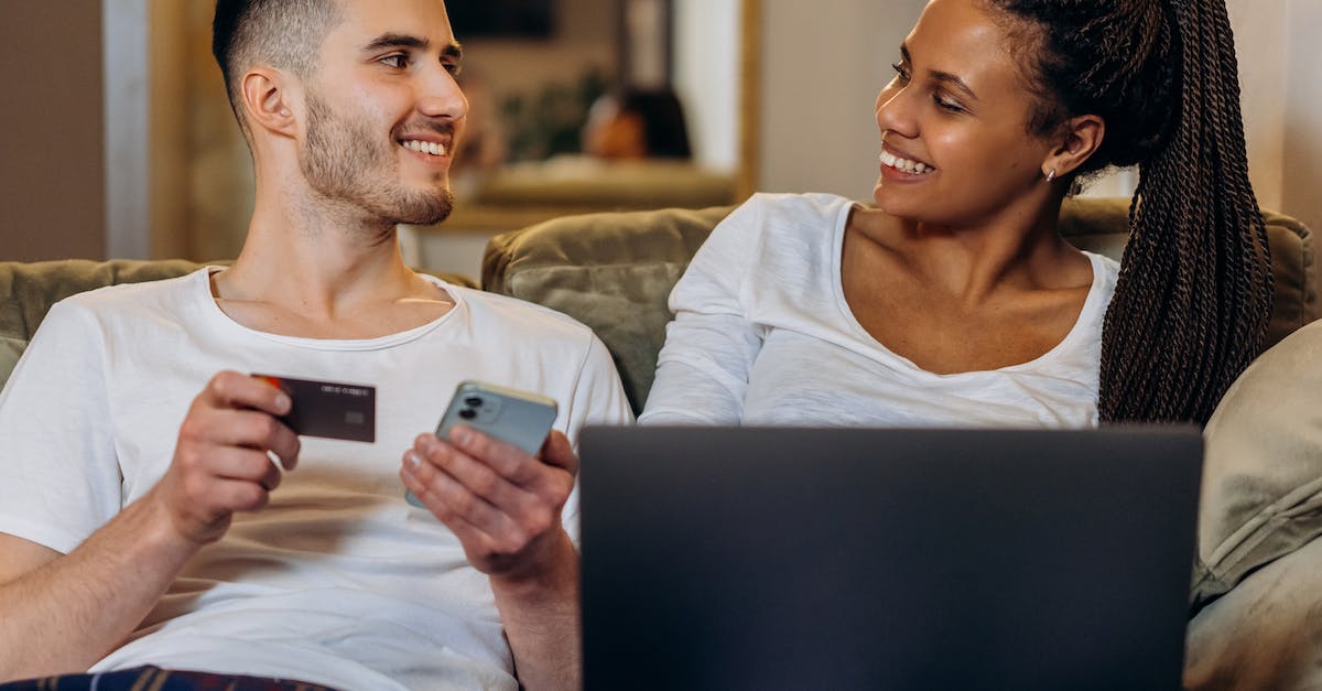 In Bulgaria do fast food chains, convenience stores, or petrol stations typically accept credit cards for small purchases? - Man in White Tank Top Holding White Smartphone