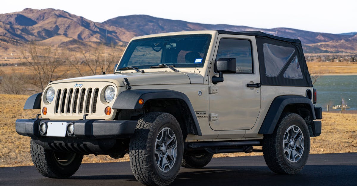 In Mongolia, what kind of vehicle is a jeep? - White Jeep Wrangler on Road