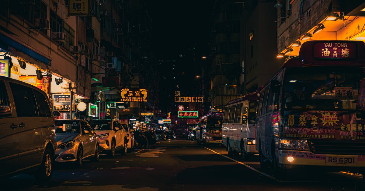 In what city is this bus (tram?) located? - Multicolored Transit Bus