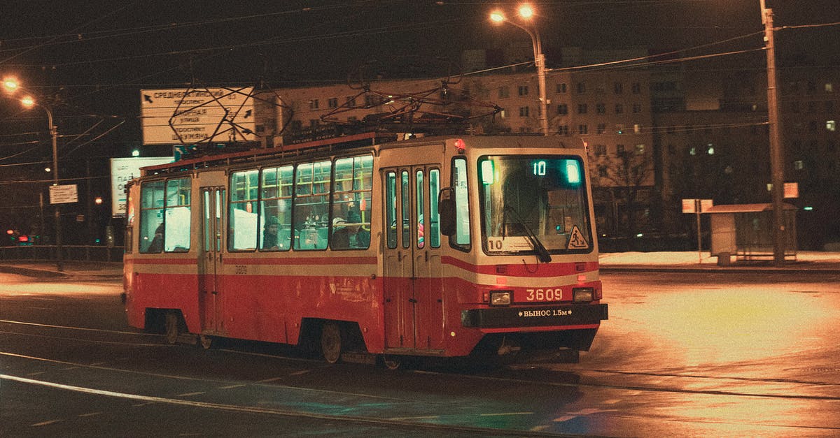 In what city is this bus (tram?) located? - Red Bus