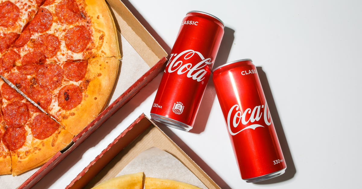 In which countries can I find spiders as traditional dishes? - Coca Cola Cans Beside Pizza