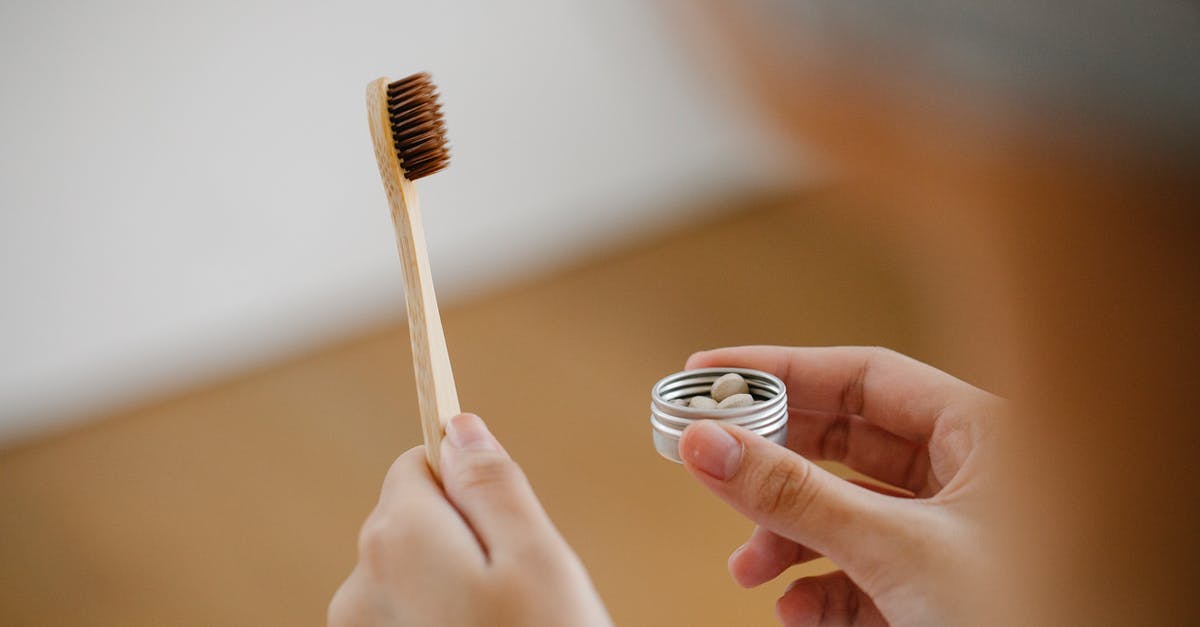 India converter 110v to 220v for Dental appliances - Unrecognizable female with wooden toothbrush and heap of toothpaste tablets in hands standing in bathroom on blurred background during hygienic routine