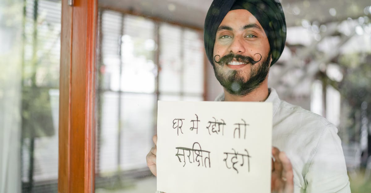 Indian National, Transit through Dublin - Content Indian guy showing paper with Hindi inscription