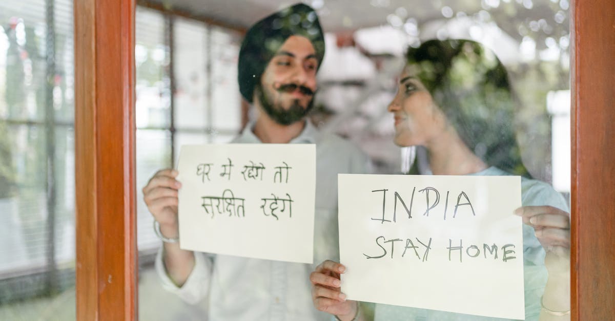 Indian National, Transit through Dublin - Optimistic young Indian couple staying at home during quarantine