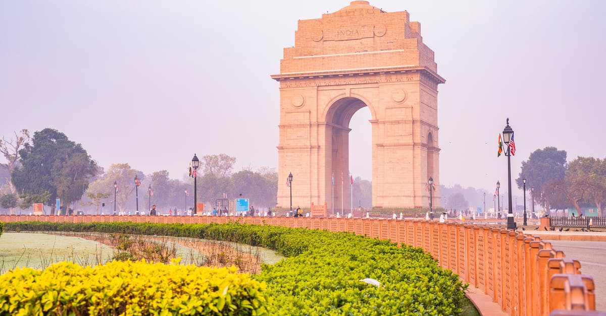 Indian national travelling from Kuwait to Dubai by road [closed] - Brown Arch Gate Near Green Grass Field